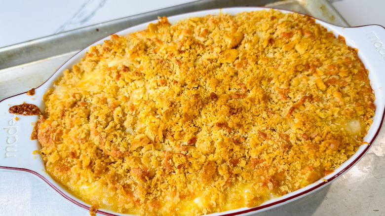 Baked corn casserole topped with browned cracker crumbs