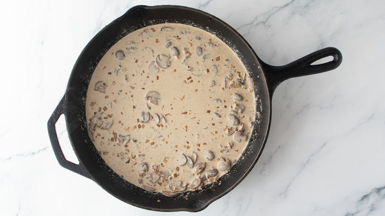 Light mushroom cream sauce in a large skillet