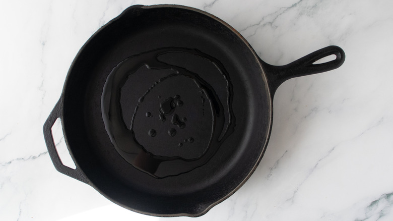Large skillet drizzled with olive oil