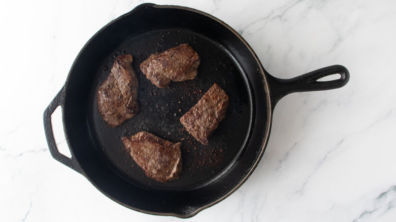 Seared steaks in large skillet