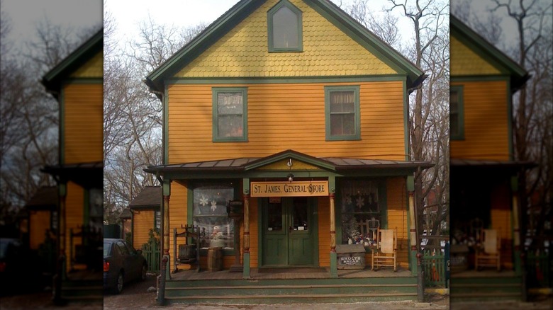 Front exterior of the St. James General Store's orange and green building
