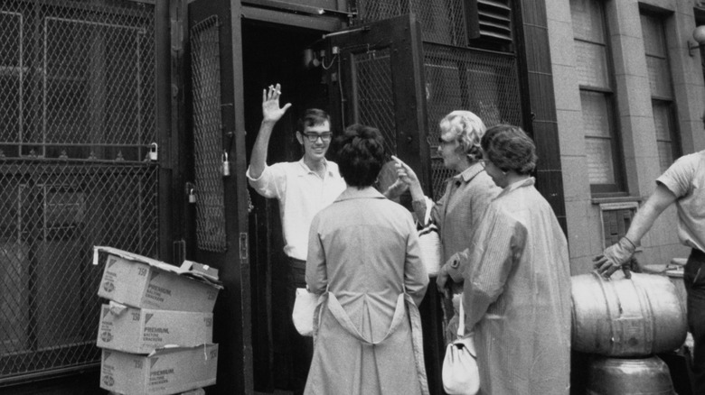 A man puts up his hand to stop women from coming into McSorley's in 1970