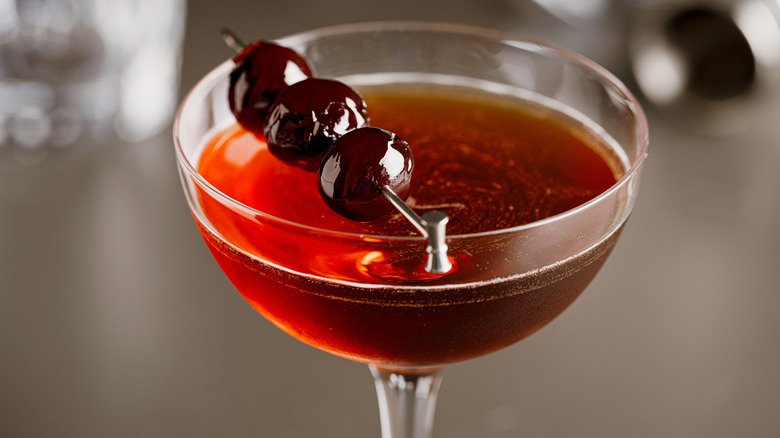 Manhattan cocktail with cherry garnish