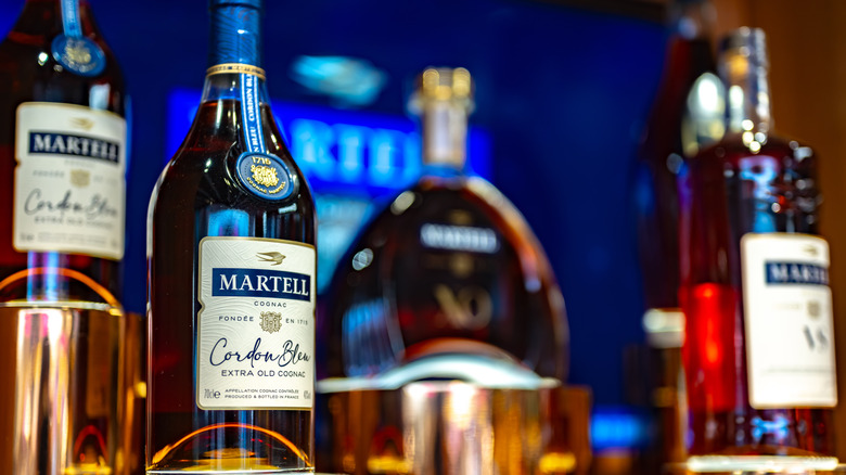 Bottles of Martell cognac with Martell Cordon Bleu in the foreground