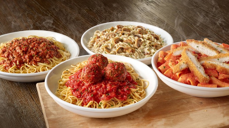 Various Olive Garden pasta dishes on a table
