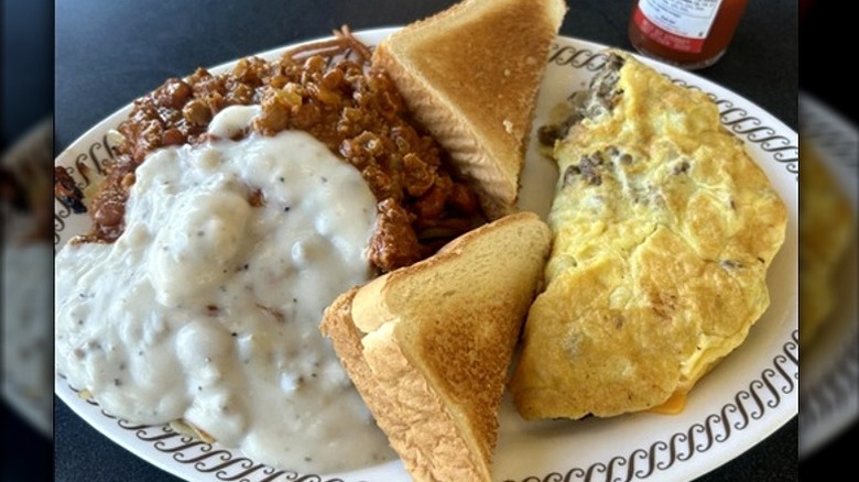 Waffle House omelet with toast and sides on plate.