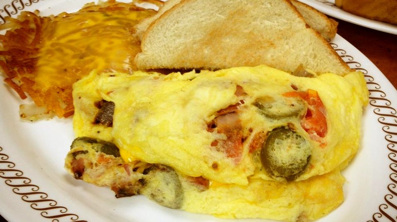 Waffle House fiesta omelet with toast and cheesy hash browns