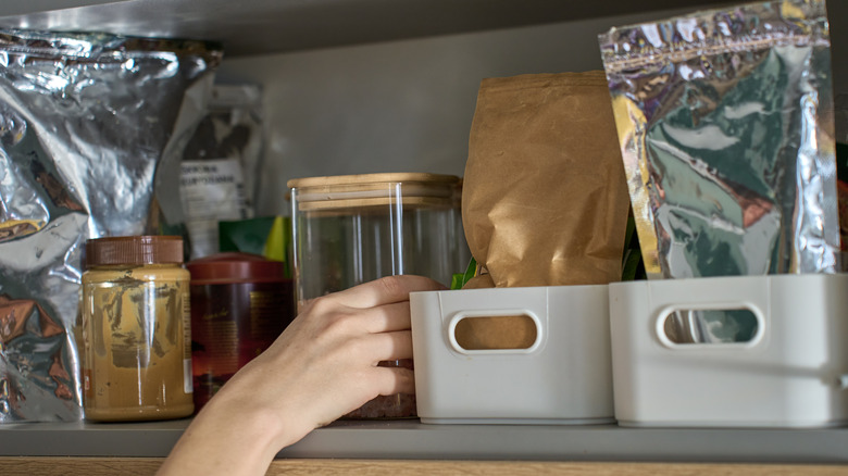 Organized kitchen shelf with multiple containers