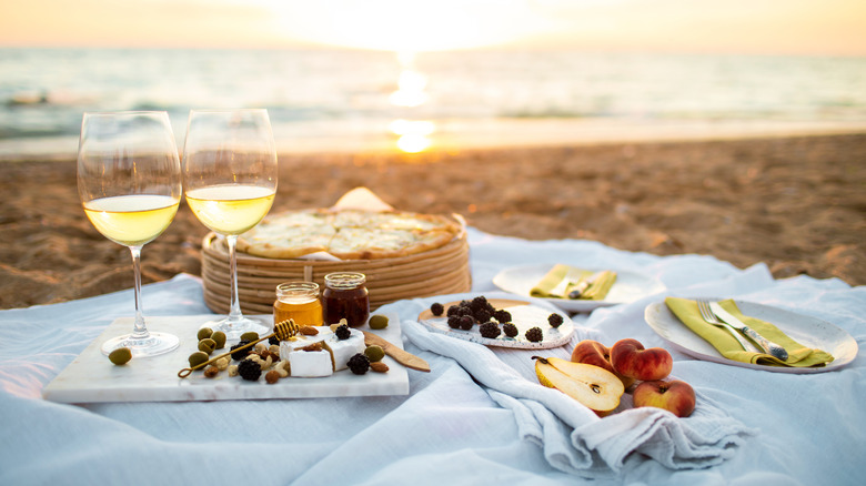 A picnic on the beach with wine and cheese