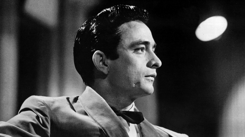 Black and white photo of a young Johnny Cash