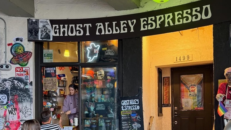 An exterior shot of Ghost Alley Espresso filled with artwork.