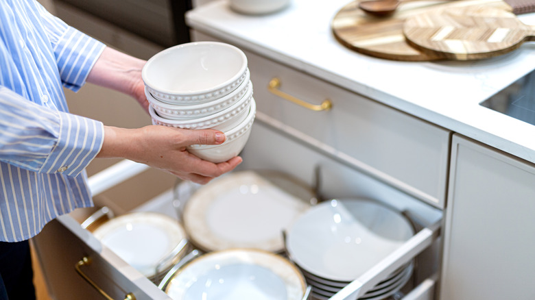Woman organizing kitchen