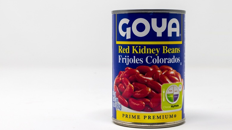 A can of Goya red kidney beans against a white backdrop.