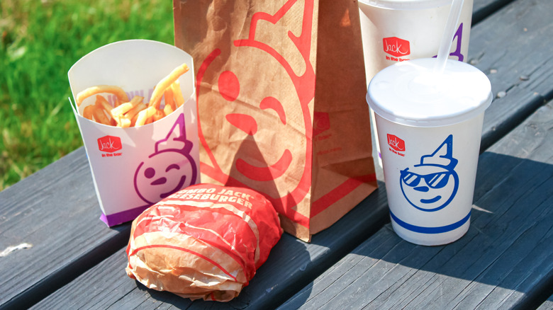 A Jack in the Box meal on a picnic table.