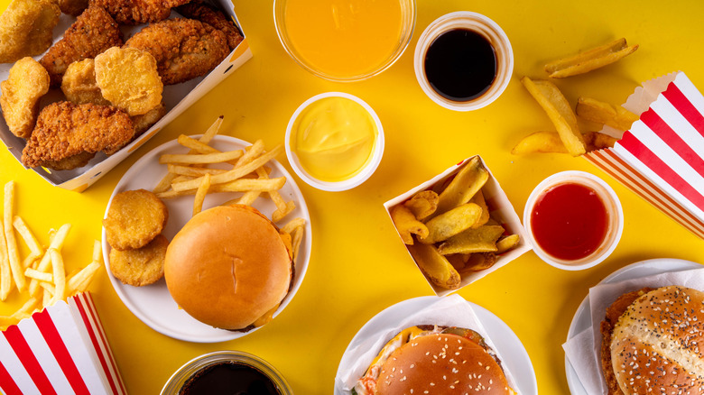 A top down view of hamburgers, fries, and chicken nuggets