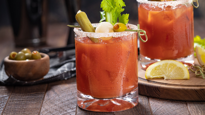 A pair of nicely garnished bloody Mary cocktails.
