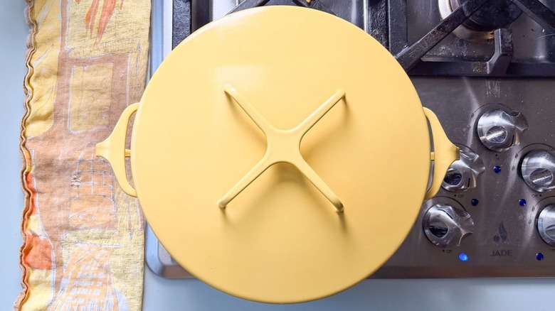 Yellow covered pot on stovetop