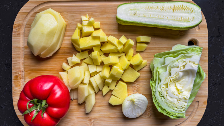 chopped vegetables sitting on a chopping board