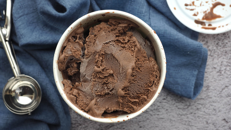 An open container of chocolate ice cream.