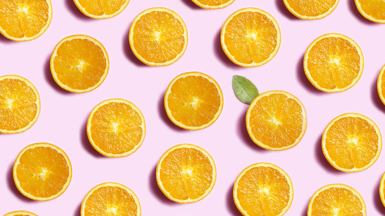 Orange slices on a pink background
