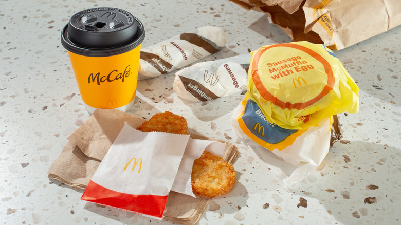Spread of McDonald's breakfast menu items with coffee