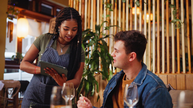 A customer talking to his server
