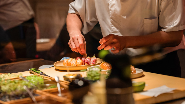 A chef preparing sushi