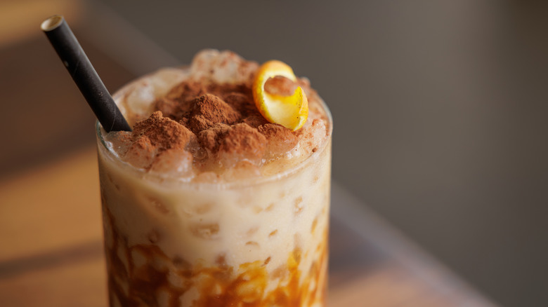 Coffee topped with cinnamon and caramel.