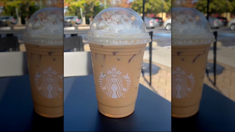 Cup of iced Cinderella style Pumpkin Spice Latte.