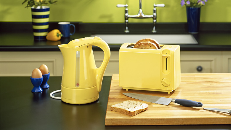 yellow appliances on a stylish kitchen counter