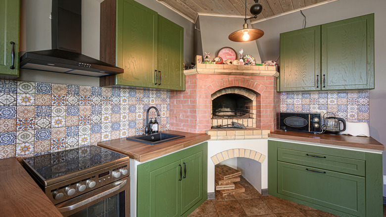 a functional range hood in a colorful kitchen with wood stove