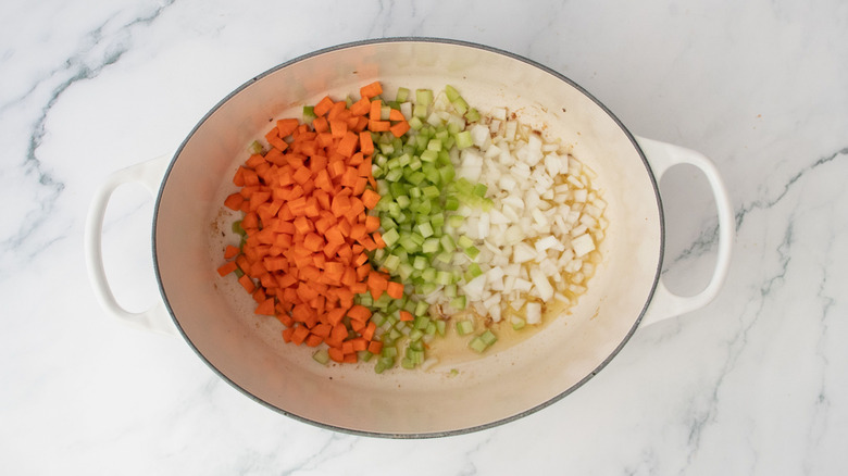 Diced carrots, celery, and onion in Dutch oven