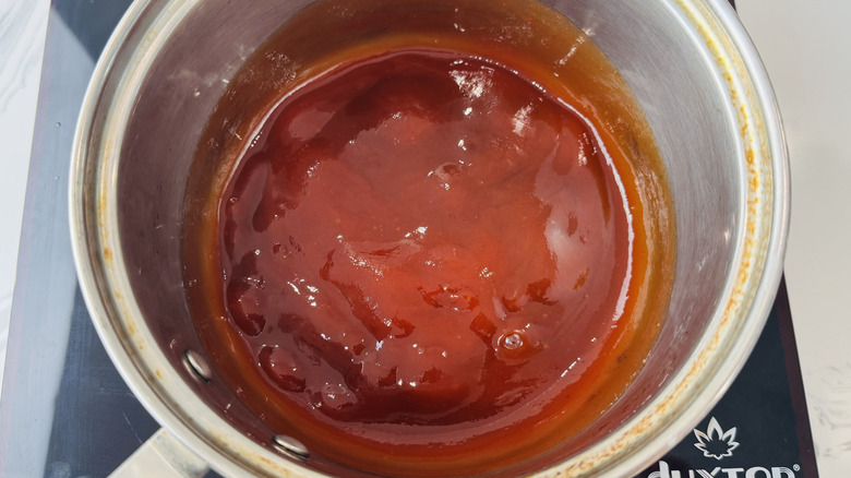 BBQ sauce ingredients simmering in saucepan