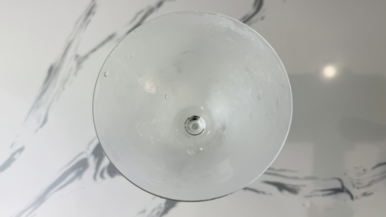 chilled and empty martini glass on marble surface