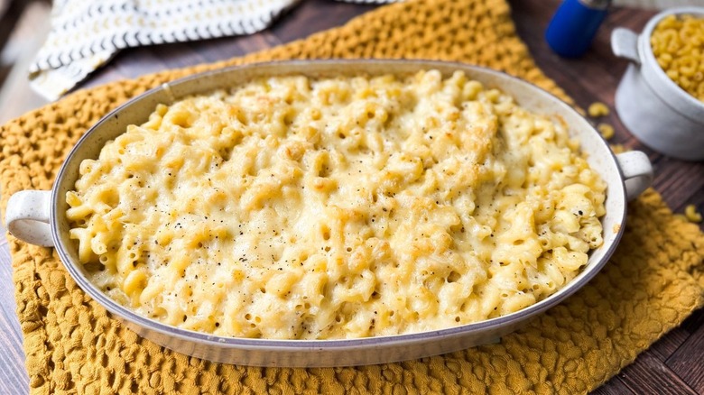 3-ingredient baked mac & cheese in serving dish on table with macaroni noodles