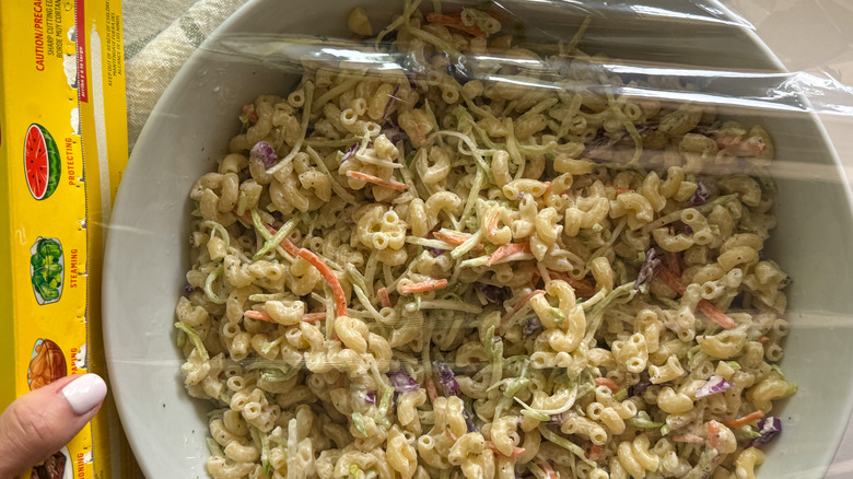 hand covering bowl with wrap