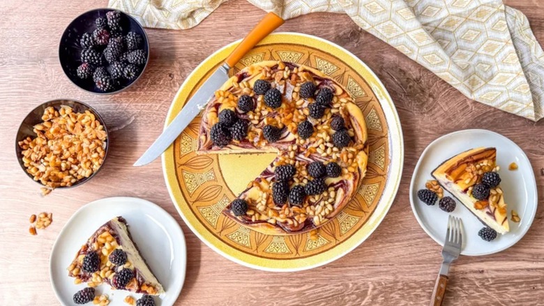 Blackberry and pine nut cheesecake on a plate