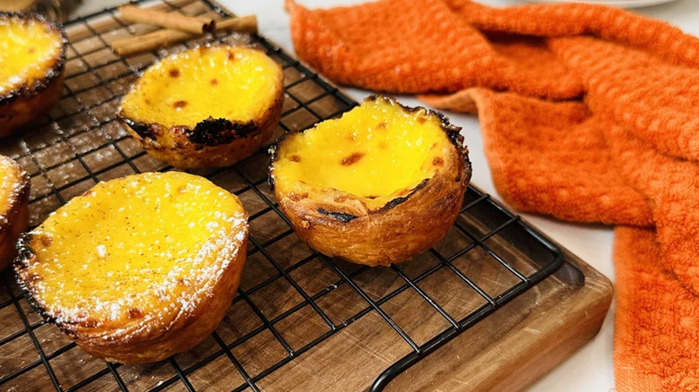 Portugese custard tarts on cooling rack