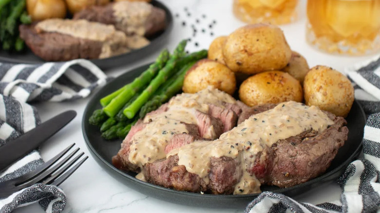Steak with whiskey sauce on a plate