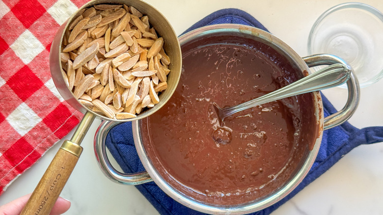 adding almonds to chocolate