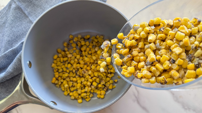 pouring corn into pot