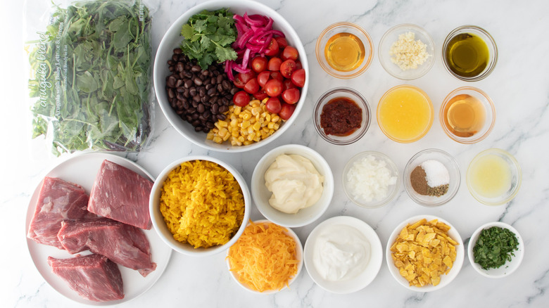 Ingredients for adobo ranch steak taco bowls on countertop