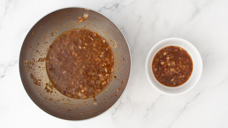 Adobo marinade in large bowl next to smaller marinade portion in small bowl