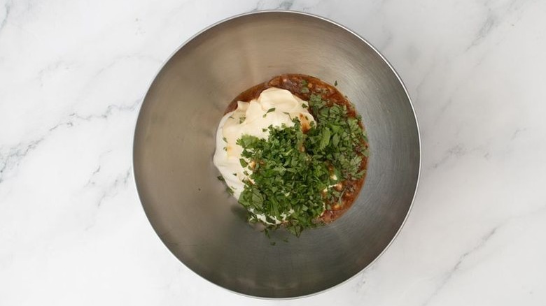Mayonnaise, cilantro, and adobo marinade in bowl