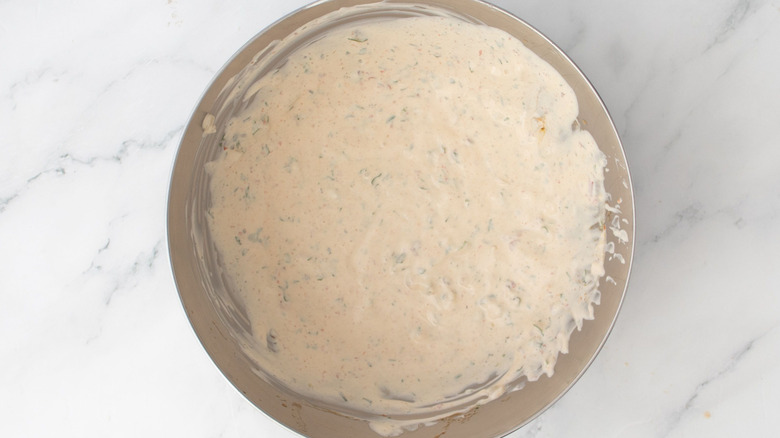 Adobo ranch dressing combined in bowl