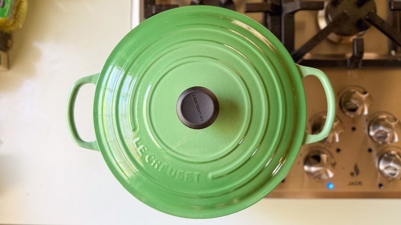 Covered green Dutch oven on stovetop
