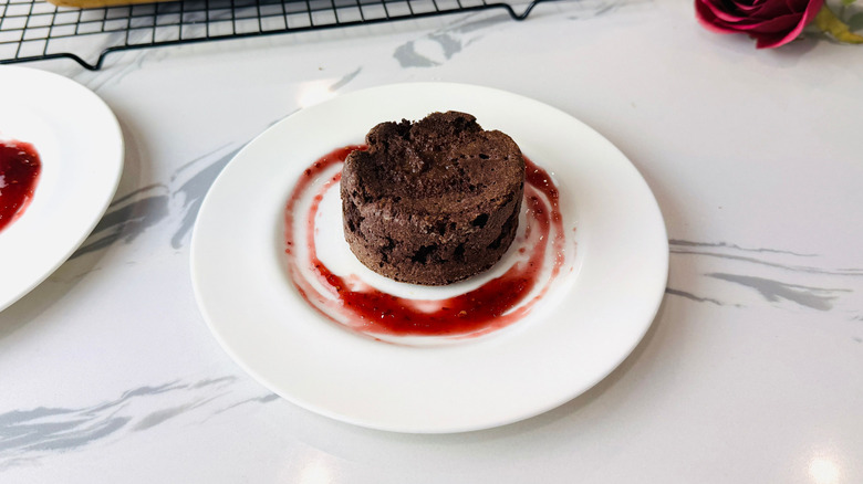 Chocolate cake on plate with jam spread