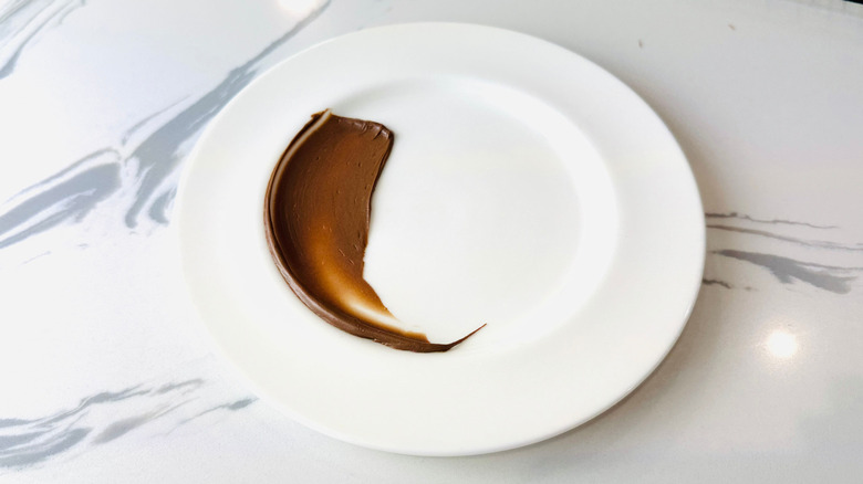 Nutella smeared on white plate