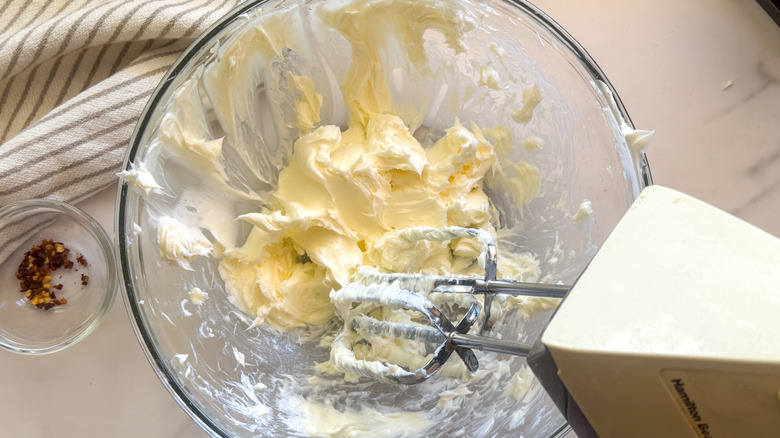 mixer in bowl blending butter