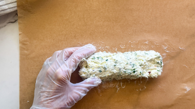 hand forming butter into log